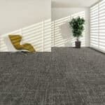 Modern room with gray carpet, yellow chair, and potted plant in sunlight through blinds