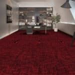 Modern living room with red carpet, gray sofa, and wall shelves