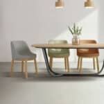 Modern dining table with gray chairs in a bright minimalist room