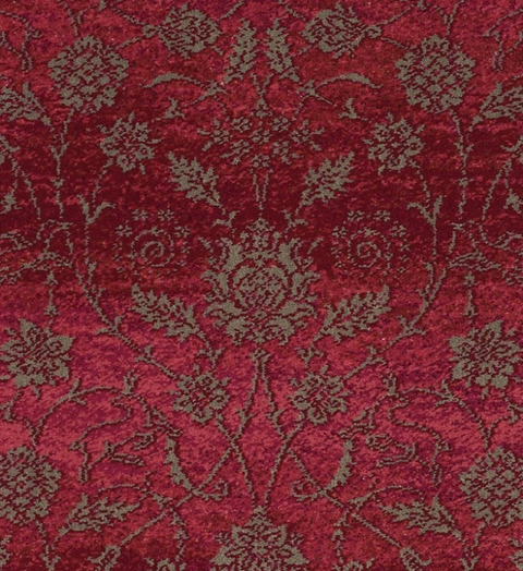 Red patterned fabric with an ornate floral and vine design