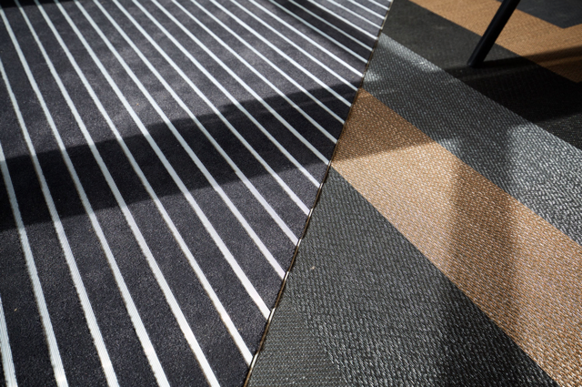 Diagonal striped floor mats in black, white, and tan patterns
