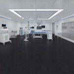 Bright white laboratory with workstations, monitors, and black flooring under fluorescent lights.