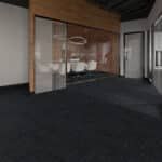 Modern interior with a wood-paneled wall, glass partition, and dark carpeted floor.