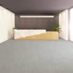 Minimal modern room with gray floor, beige bed or bench, wall lights, and potted plants