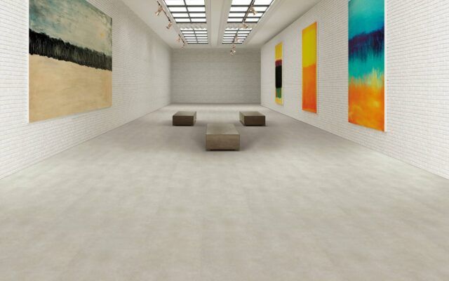 Minimalist art gallery with abstract wall paintings and low benches in a bright white room