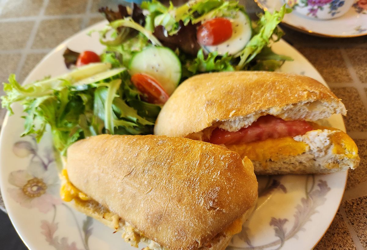 Two tuna melt sandwiches and a salad.