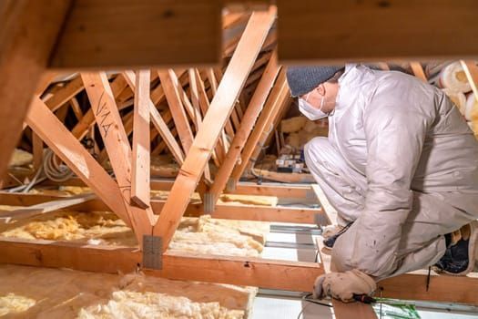 insulation-professional-insepcting-attic-insulation-in-cheyenne