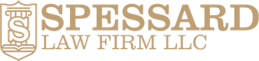 Logo for Spessard Law Firm LLC featuring a tan shield icon with an 'S' and a pillar, followed by the company name.