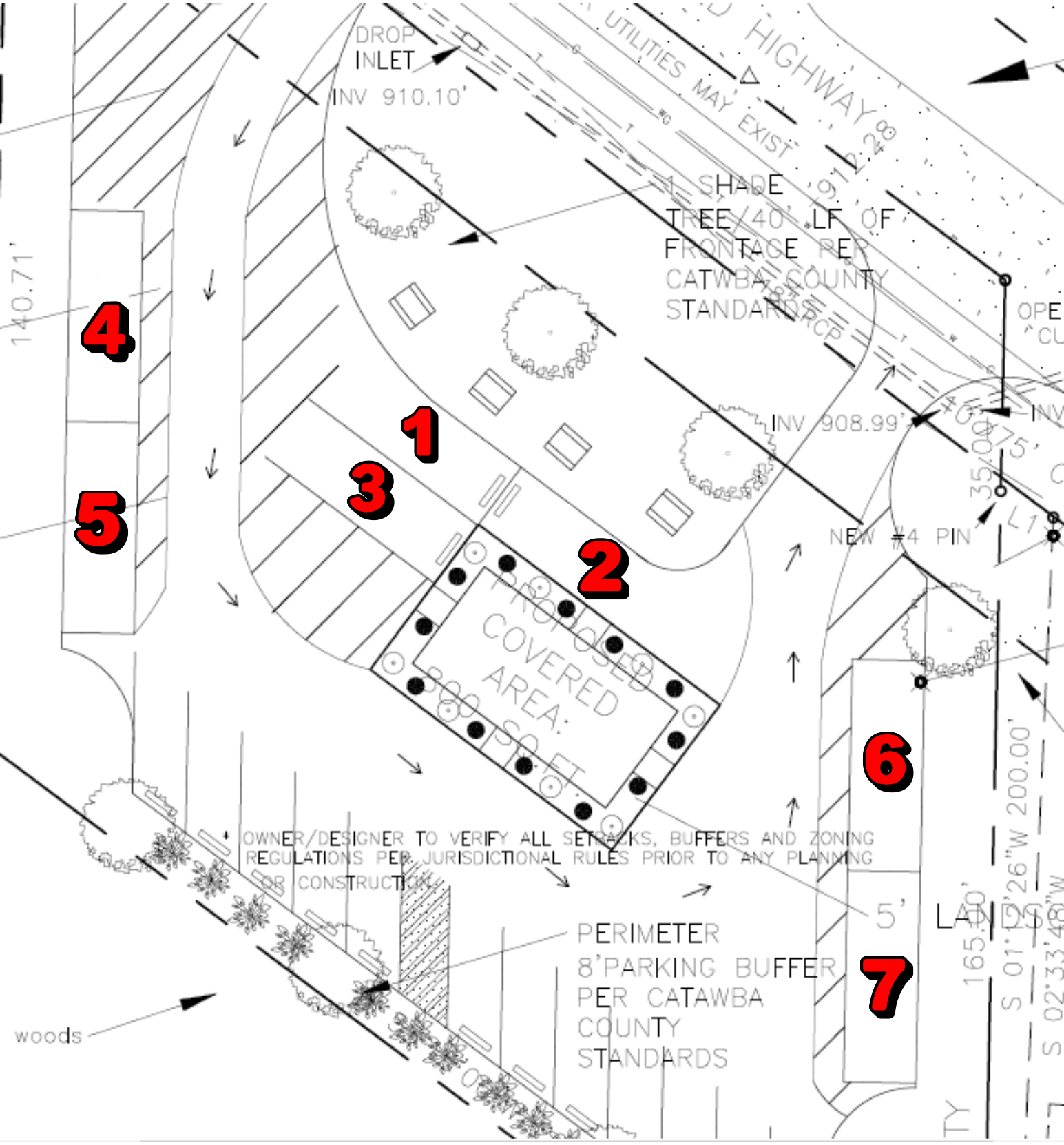 Detailed site plan showing a covered area, parking, landscaping, and road access. Numbers indicate specific site features.