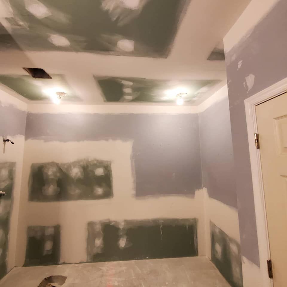 A room with a ceiling that has a hole in it.