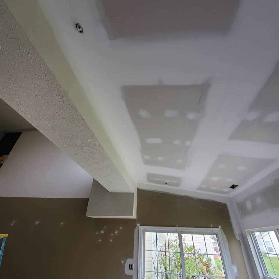 A room with a ceiling that has a lot of holes in it.