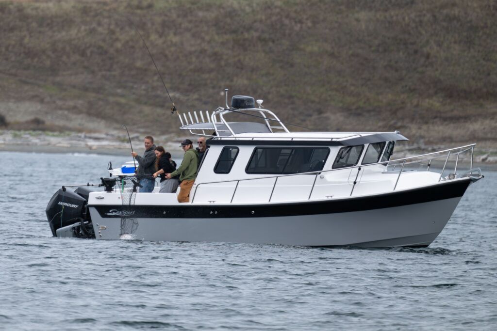 A Sea Sport 28' Commander boat with Tanner Manufacturing stainless steel rails on it.