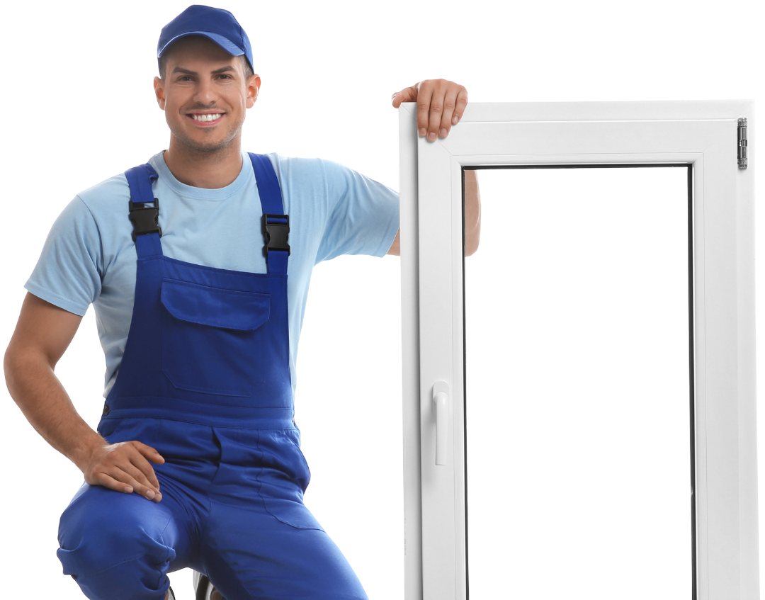 Man in blue overalls and cap smiles, holding a white window.