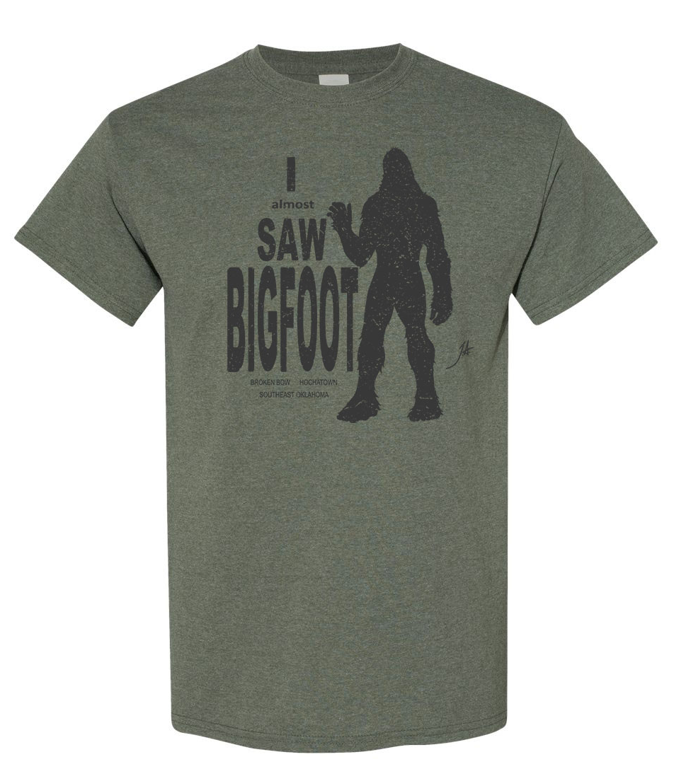 Light beige T-shirt with a small chest crest logo on a white background