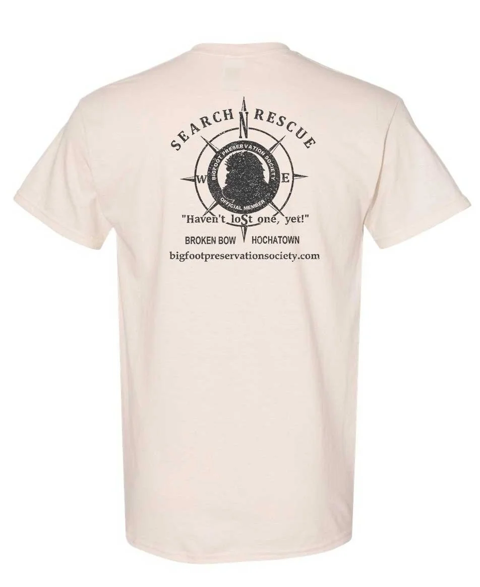 Off-white T-shirt with black “Search & Rescue” circular graphic on the chest.