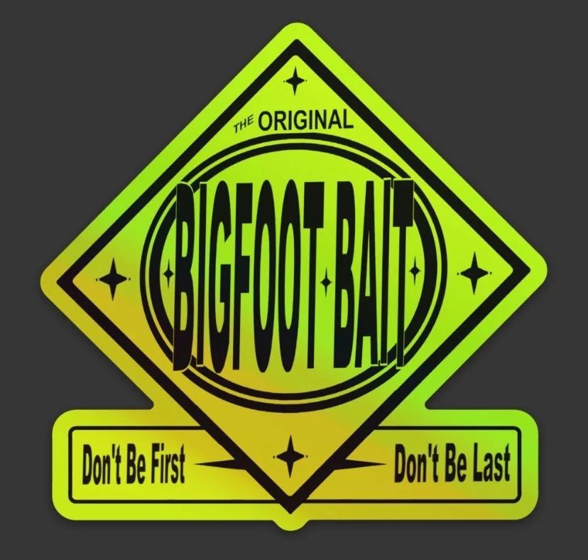 Neon green Bigfoot Bait sign with black lettering and the slogan “Don’t Be First, Don’t Be Last.”