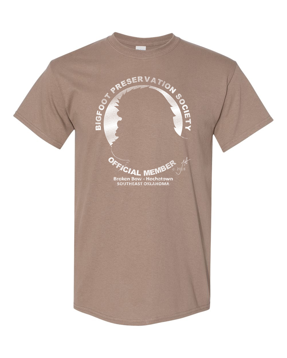 Brown graphic T-shirt with white circular text and central emblem on a plain white background