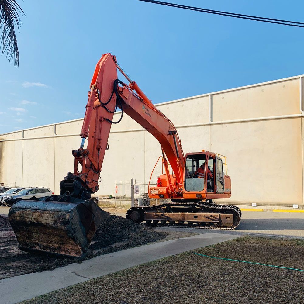An Orange Excavator At Work