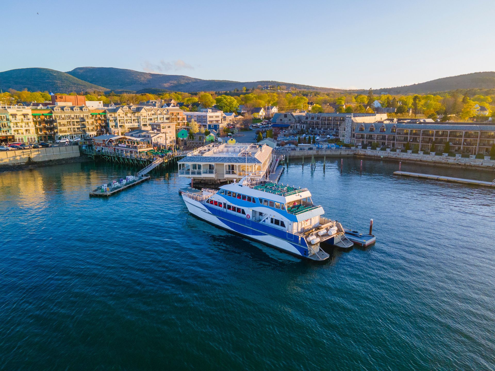 An aerial view of a large boat floating on top of a body of water.