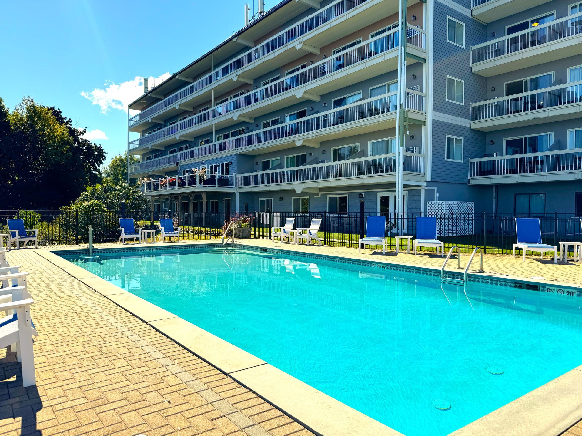 A large swimming pool in front of a building