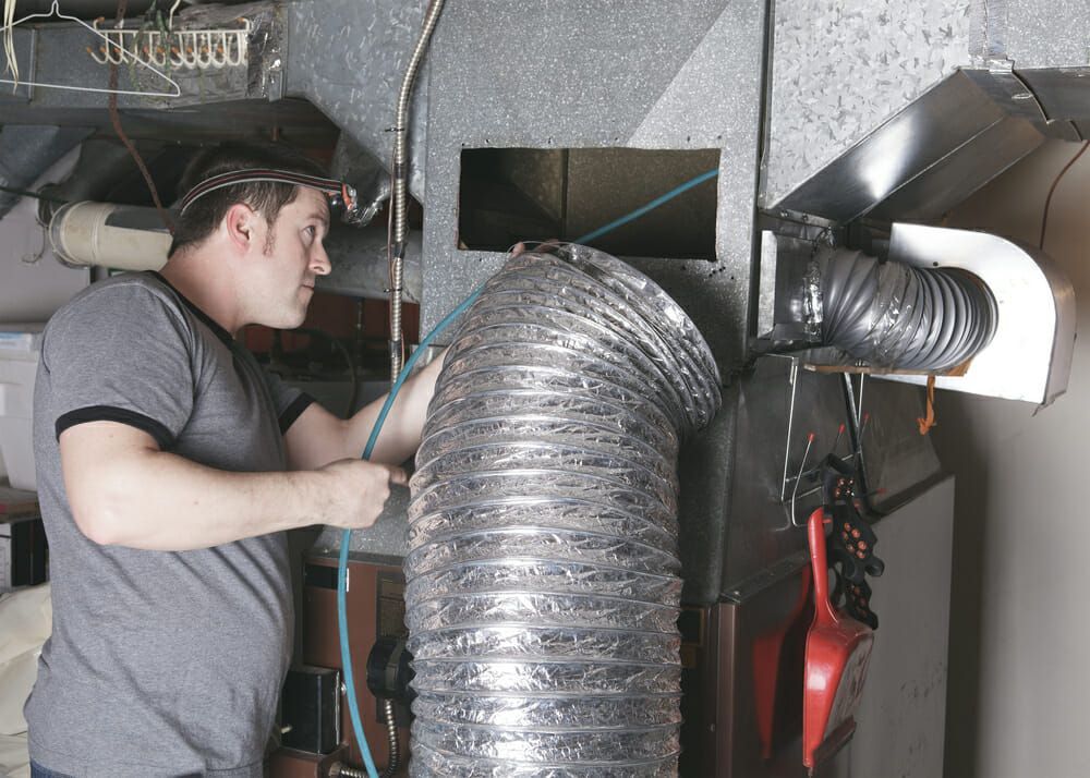 HVAC professional installing a new HVAC system