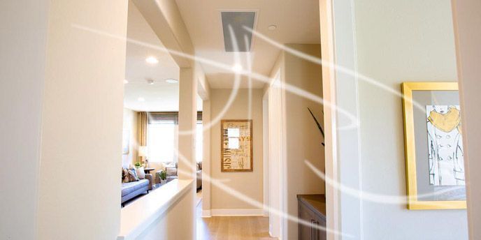 A hallway in a house with a picture on the wall