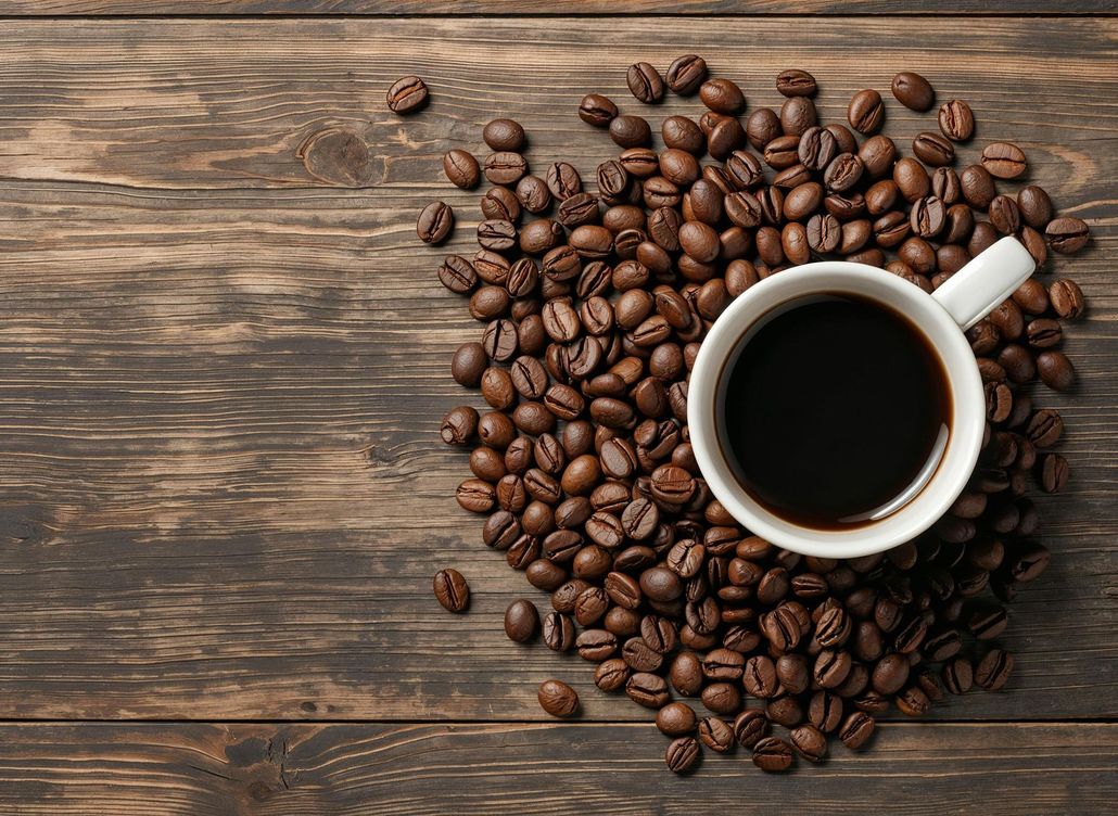 Green coffee cup and saucer on a table with a blurred café background