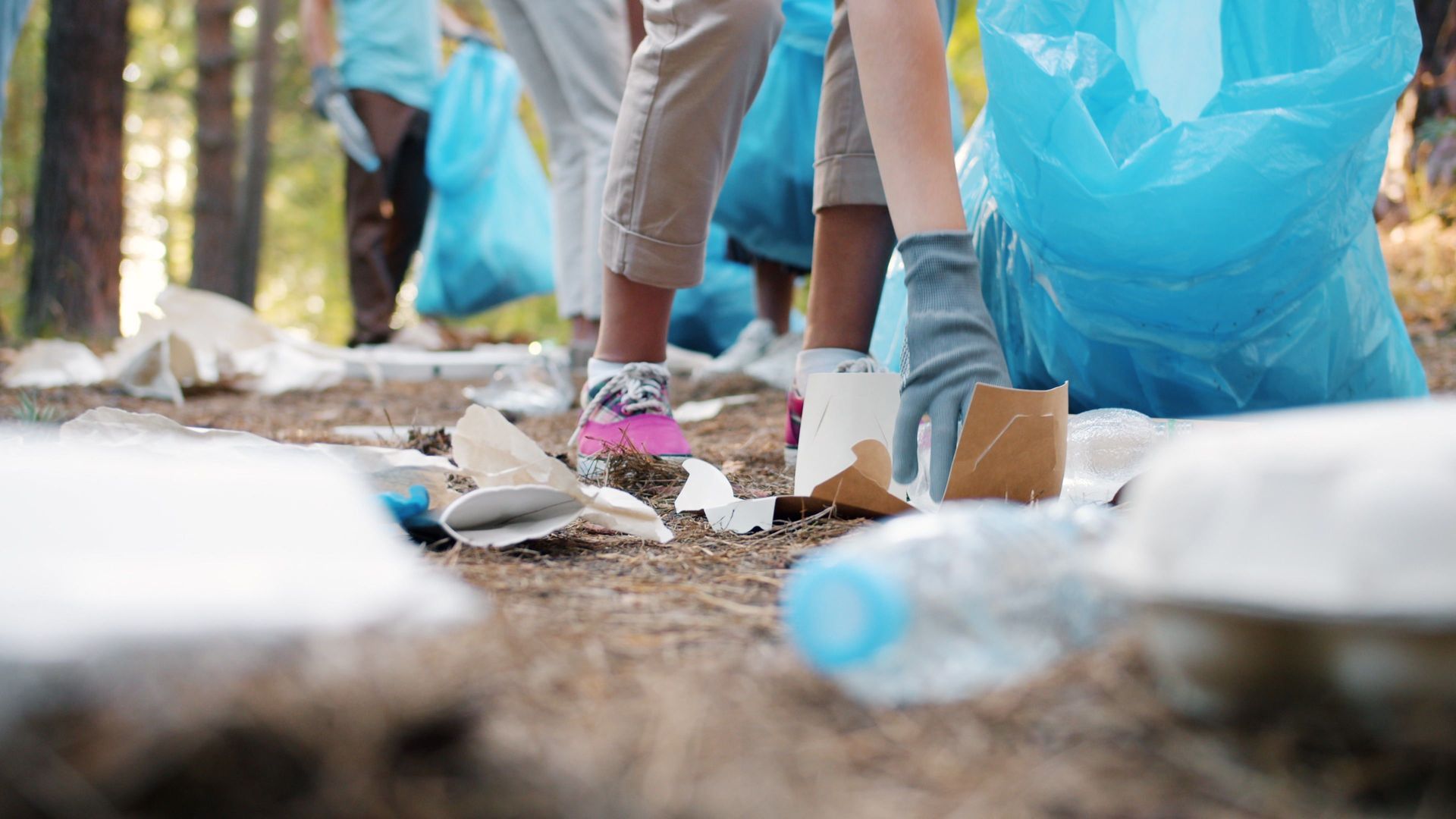 Picking up trash in nature