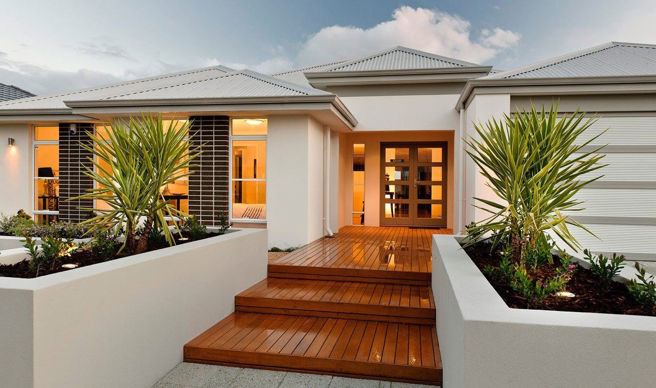 Exterior shot of a stunning home in Perth with a unique colour scheme that stands out in the neighbourhood. Expert exterior styling in Perth is evident with the complementary landscaping and design elements.