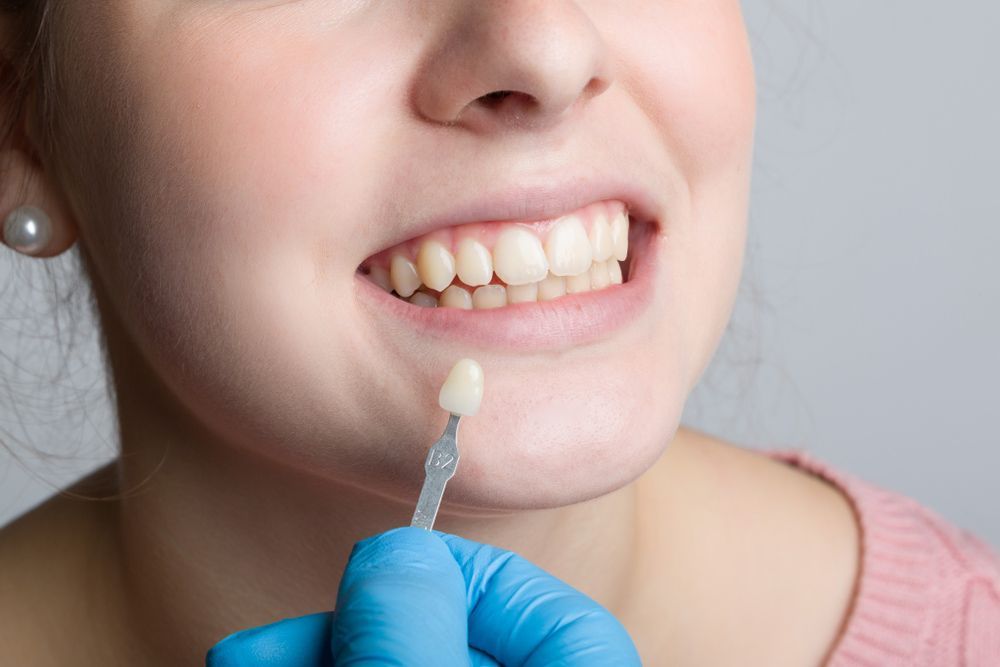 A Woman Is Getting Her Teeth Examined By A Dentist — Regal's Dental In Emu Park, QLD