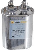 Silver Titan capacitor with two top terminals and black label on a white background