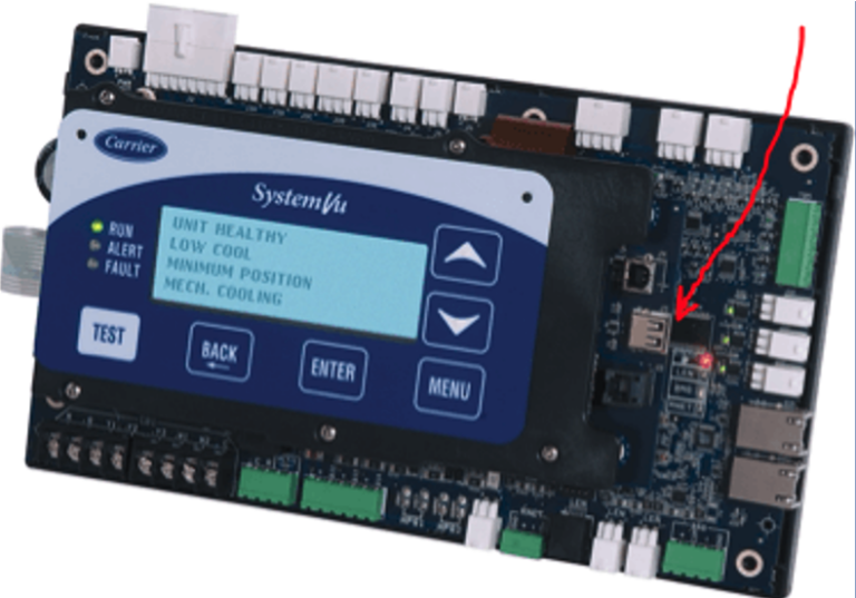 Electronics control board with display and buttons, red arrow pointing to a chip on the right
