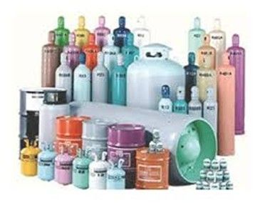 Assorted colorful gas cylinders and tanks arranged on a white background