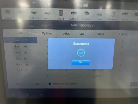 Computer screen showing a blue “Succeeded” confirmation dialog with an OK button over an Auto Topology page