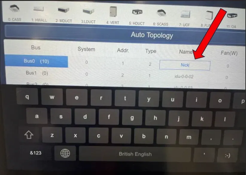 Tablet showing an “Auto Topology” form with an on-screen keyboard open and a red arrow pointing to a field.