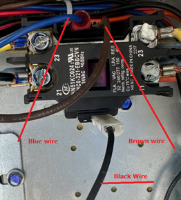 Electrical wiring close-up with blue, brown, and black wires connected to a relay terminal block.