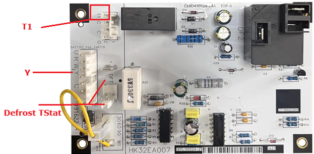 Annotated appliance control board with red labels pointing to T1, V, and defrost thermostat connectors