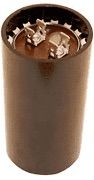 Brown cylindrical trash can filled with crumpled paper and cardboard scraps