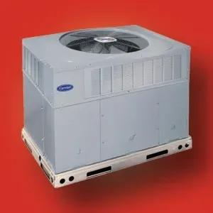 Gray outdoor air conditioner unit on a metal base, shown against a red background