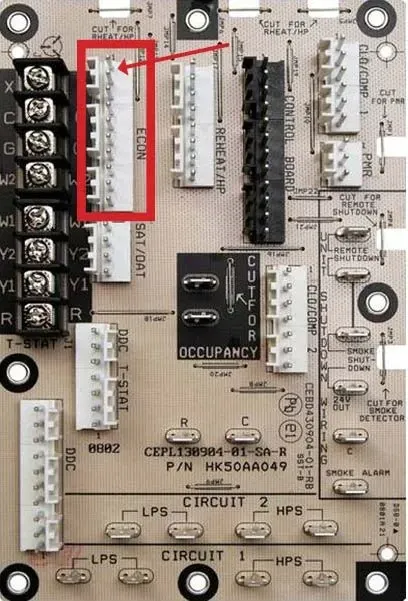 Circuit board with relays and connectors, one component area outlined in red.
