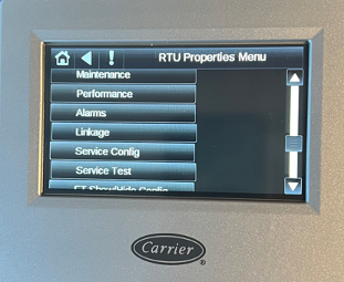 Carrier RTU properties menu on a control screen with maintenance, performance, alarms, and settings options.