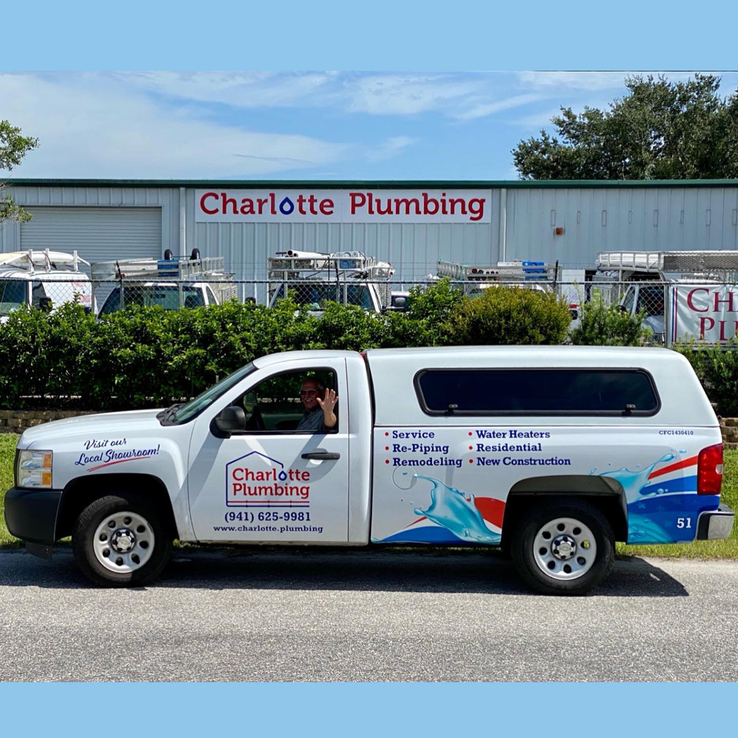 A Plumber Man Waving From The Charlotte Company Car — Port Charlotte, FL — Charlotte Plumbing