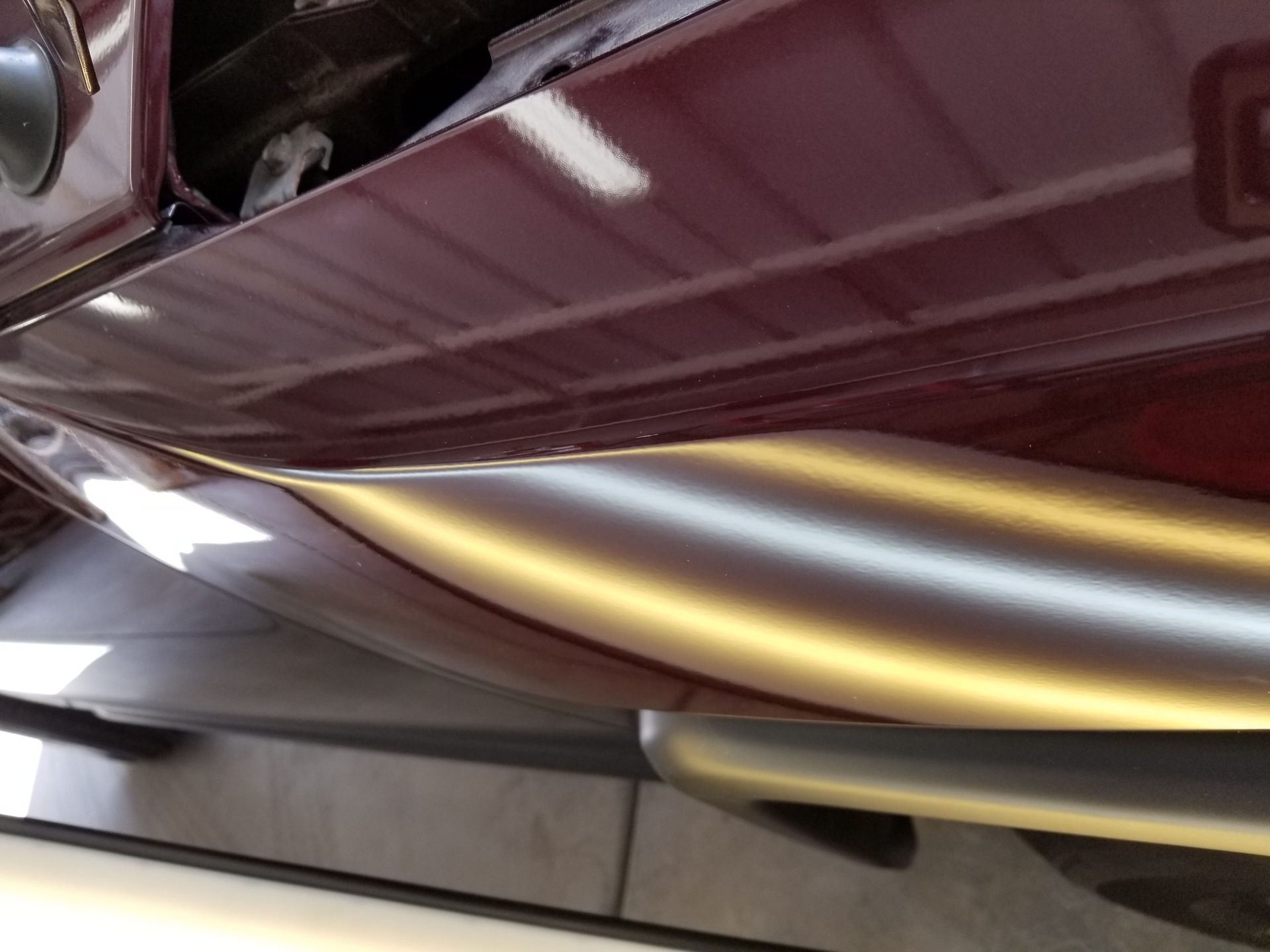 a dent in a car after it has been repaired