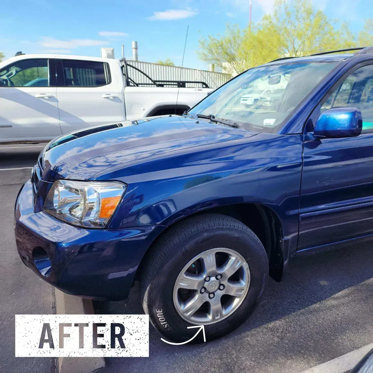 a blue truck that has recently had it's auto body repaired