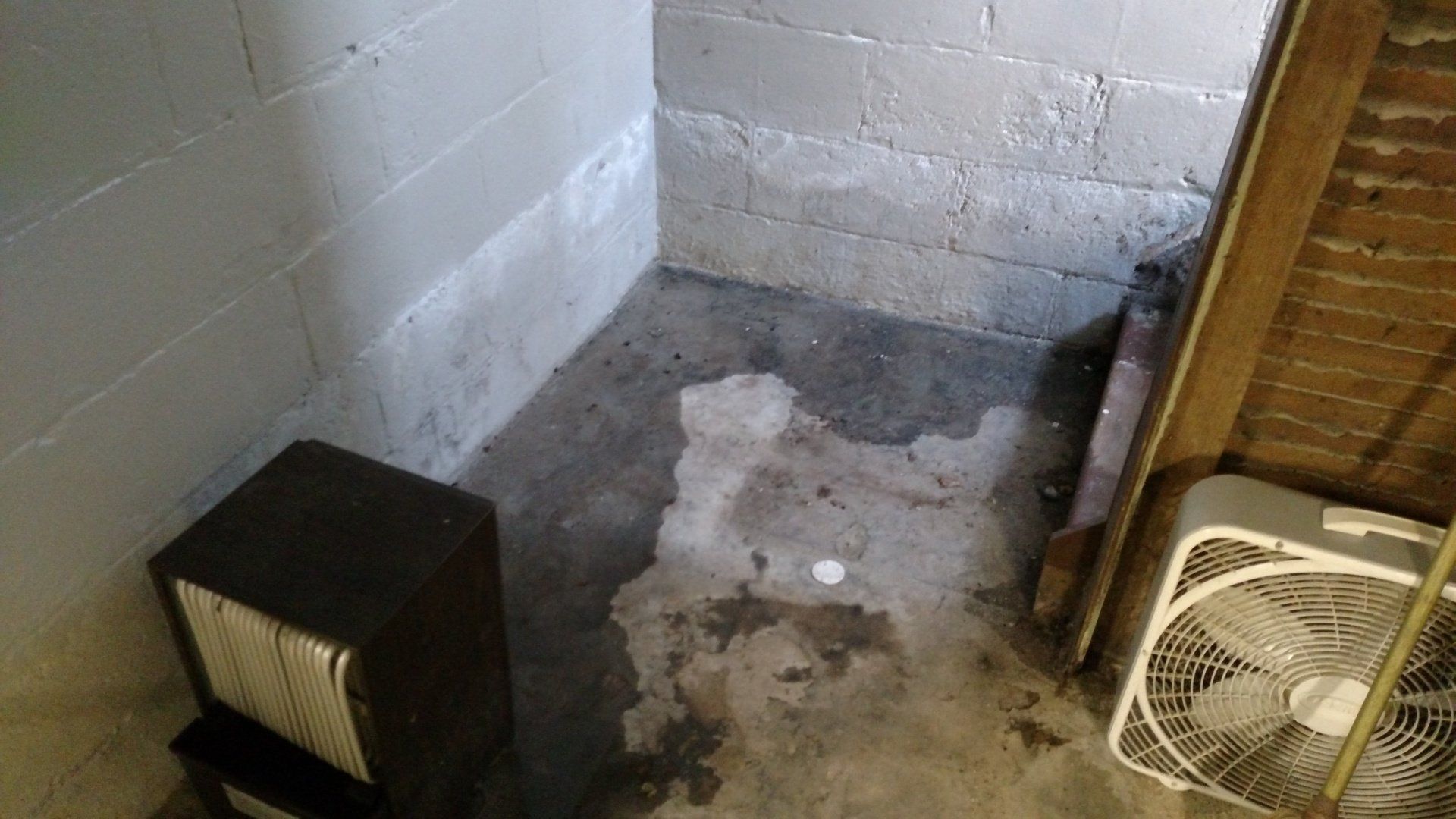 basement waterproof paint A room with a fan and a speaker in it.