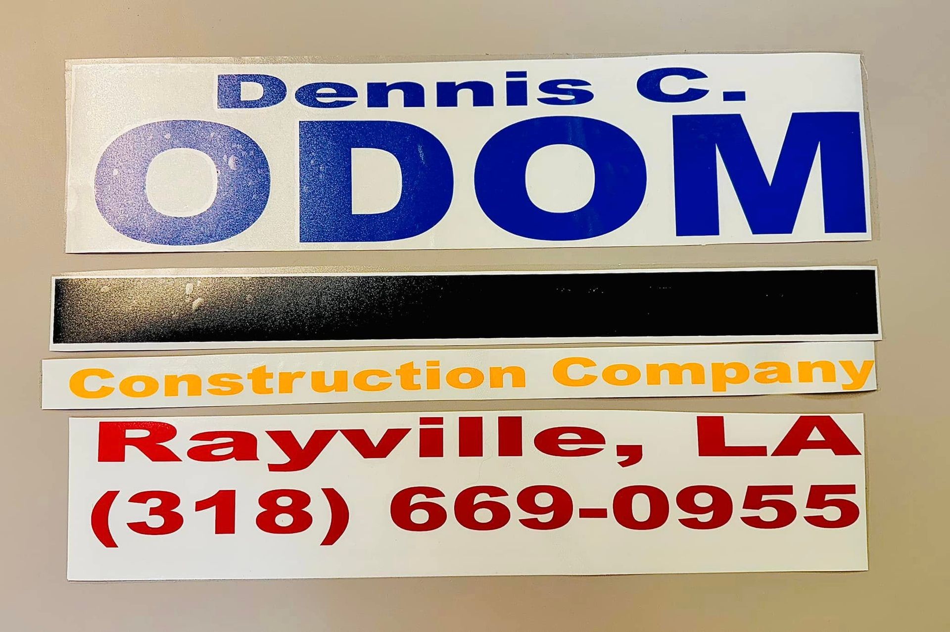 A sign for dennis c. odom construction company in rayville la