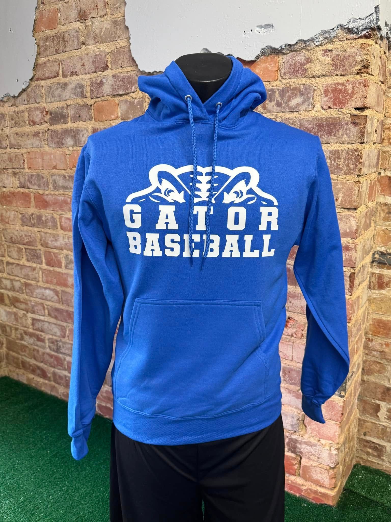 A blue gator baseball hoodie is on a mannequin in front of a brick wall.