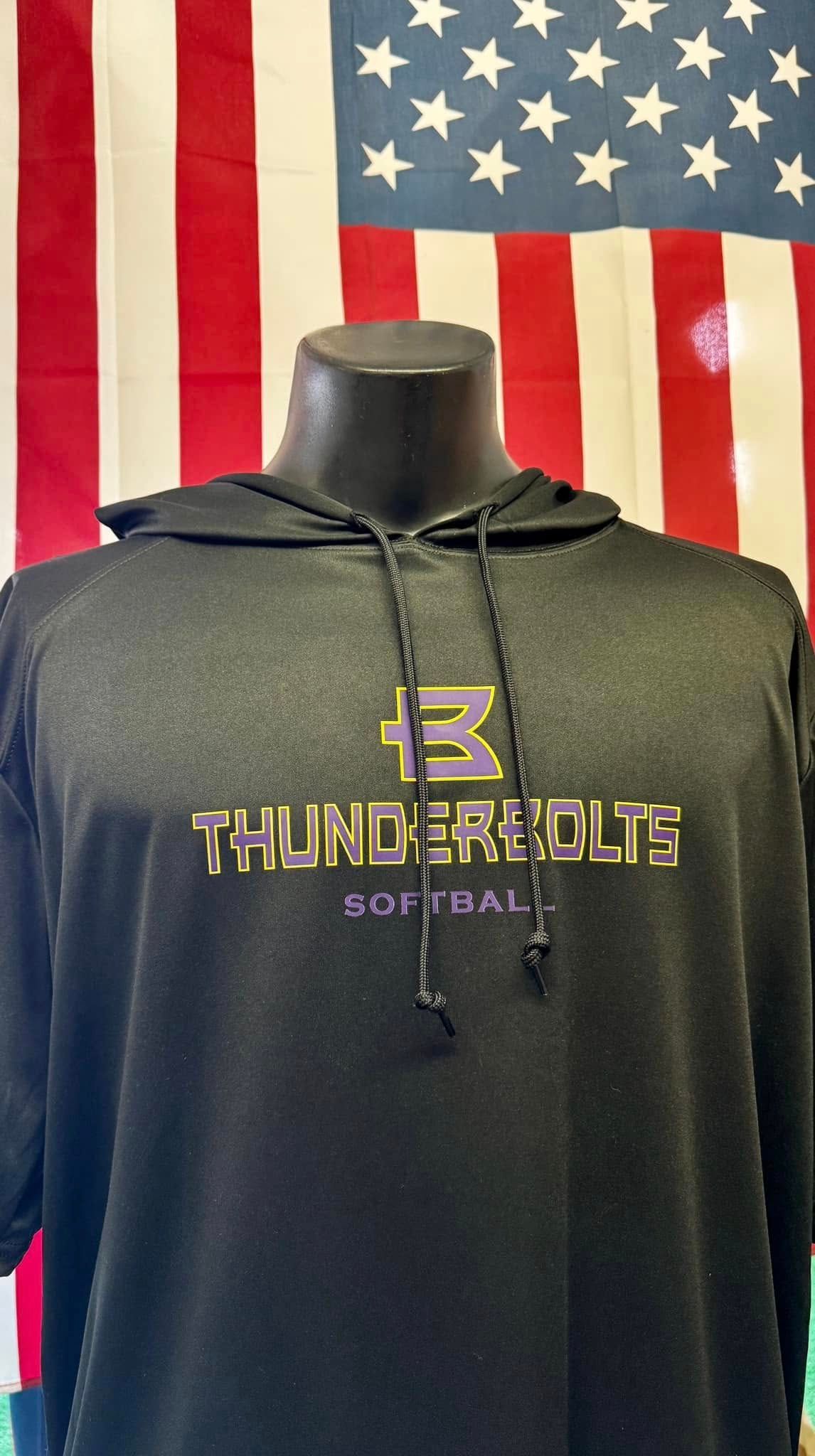 A black hoodie is on a mannequin in front of an american flag.