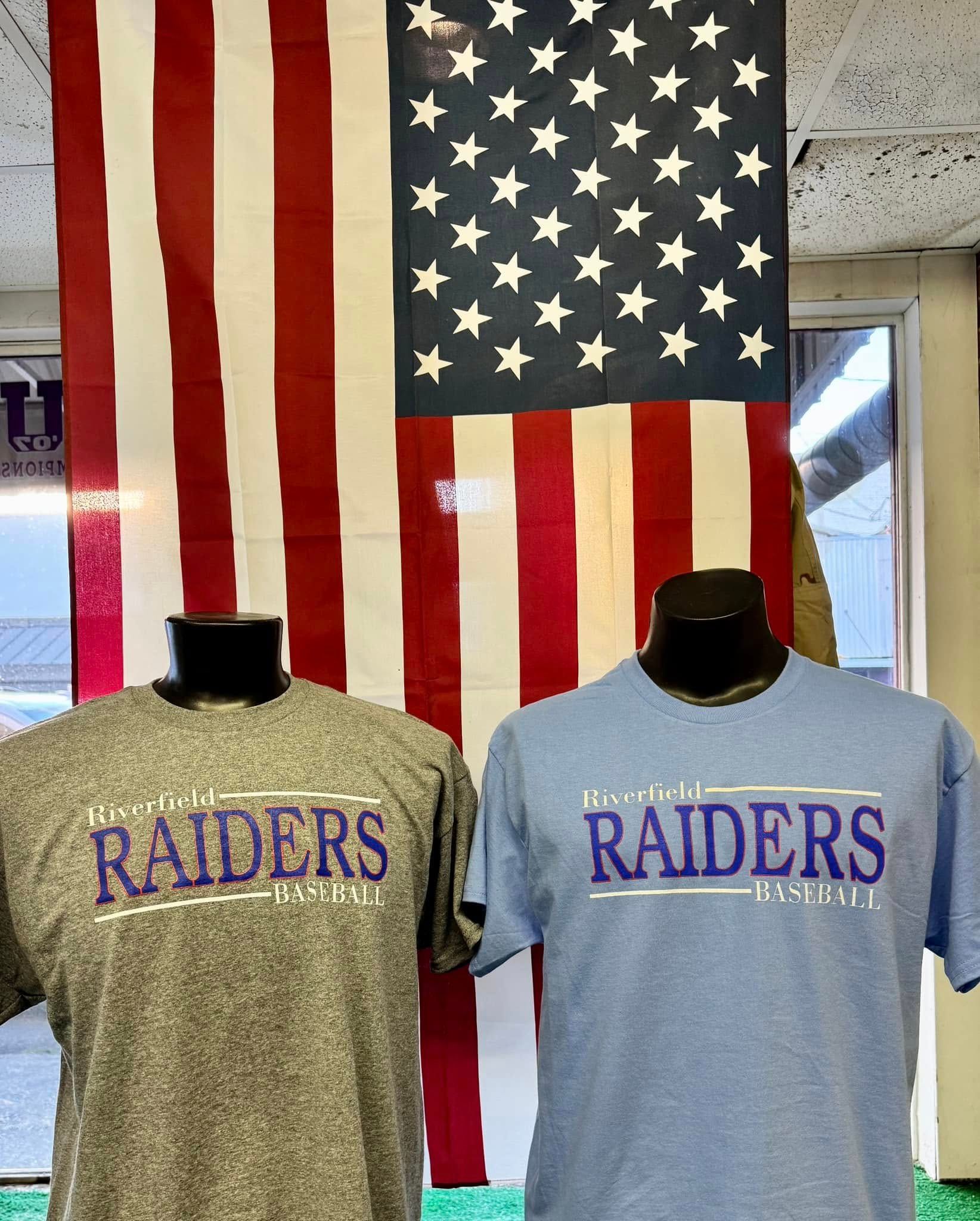 Two raiders shirts are displayed in front of an american flag