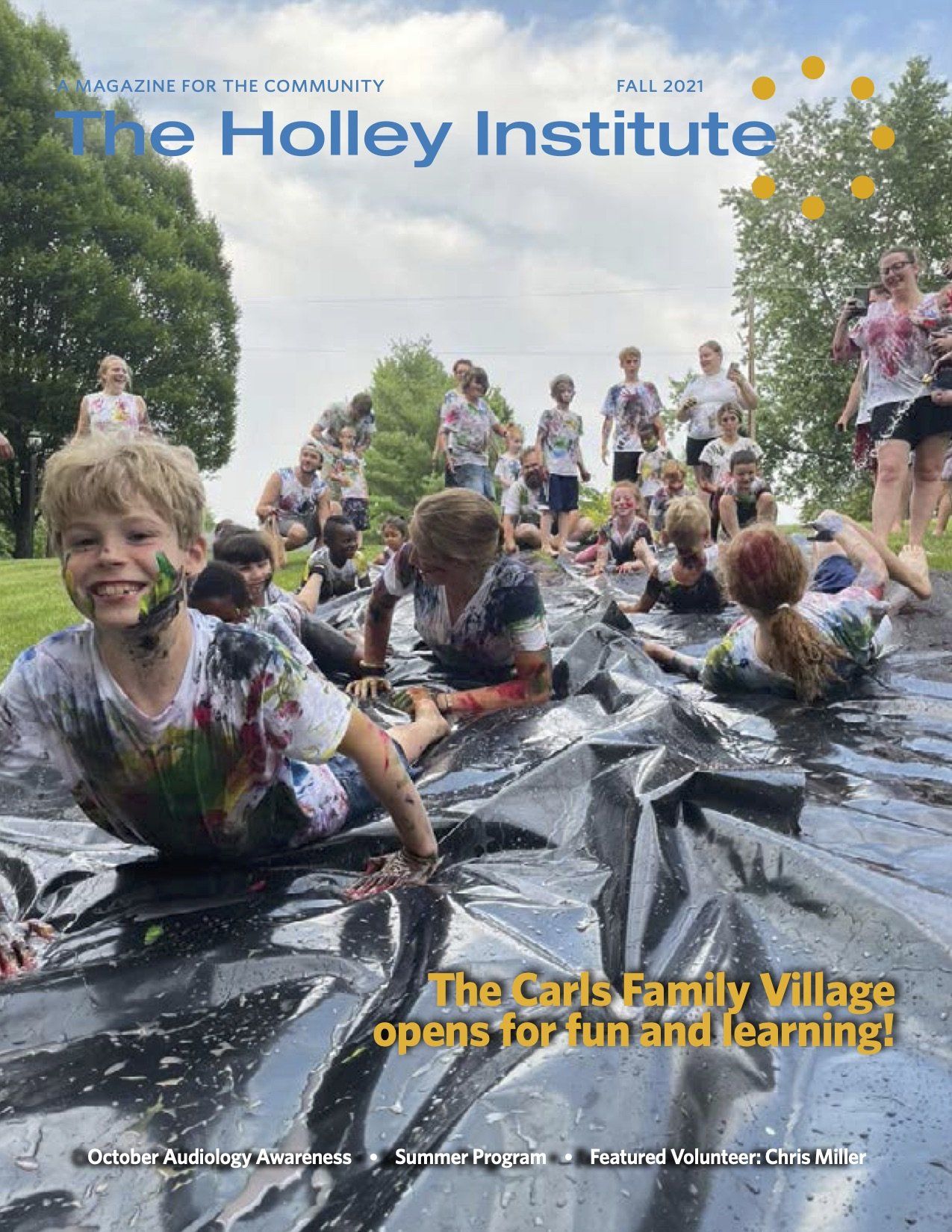 A group of children are playing in the mud on the cover of a magazine.